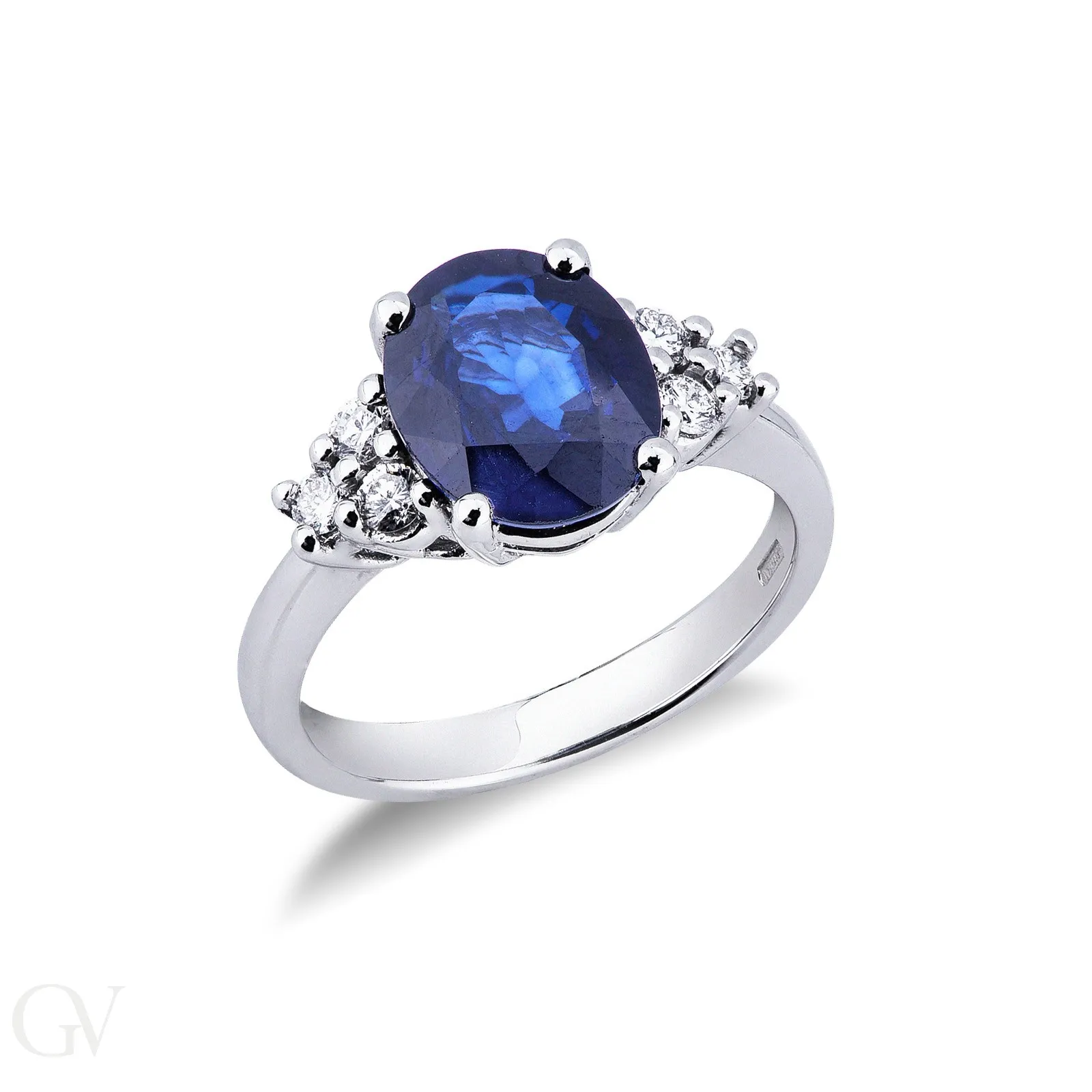 Anello in oro bianco 18k con centrale in Zaffiro Blu e diamanti