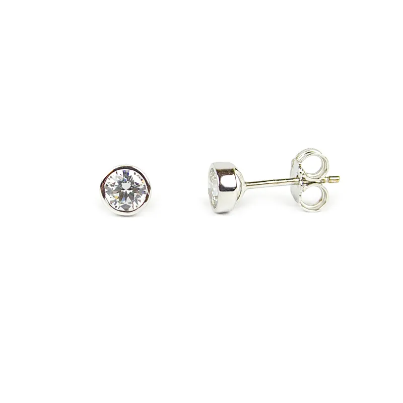 Orecchini punti luce in oro bianco con zircone