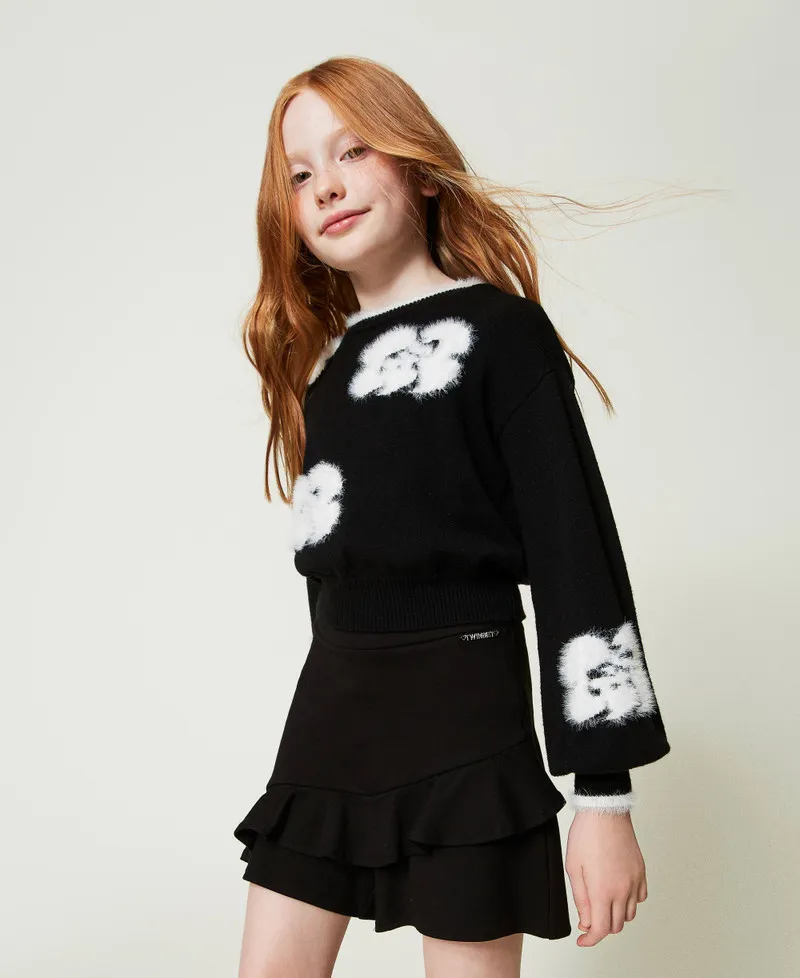 Shorts con volant e logo